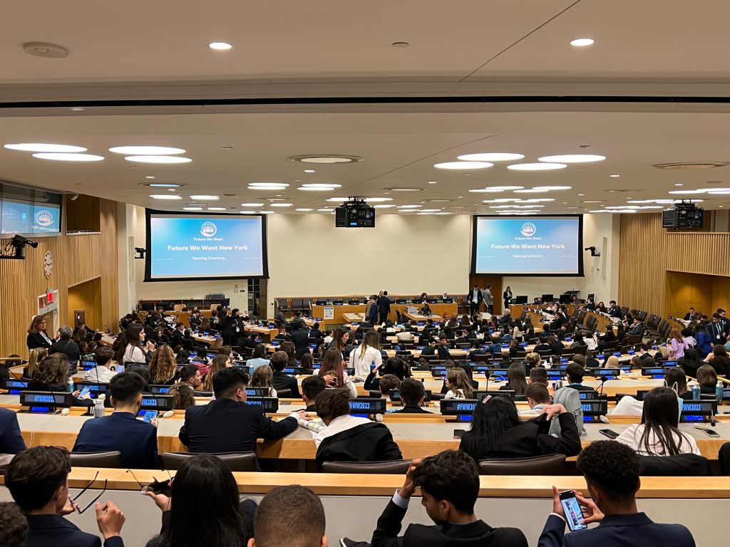 A photo of a UN session room with young leaders