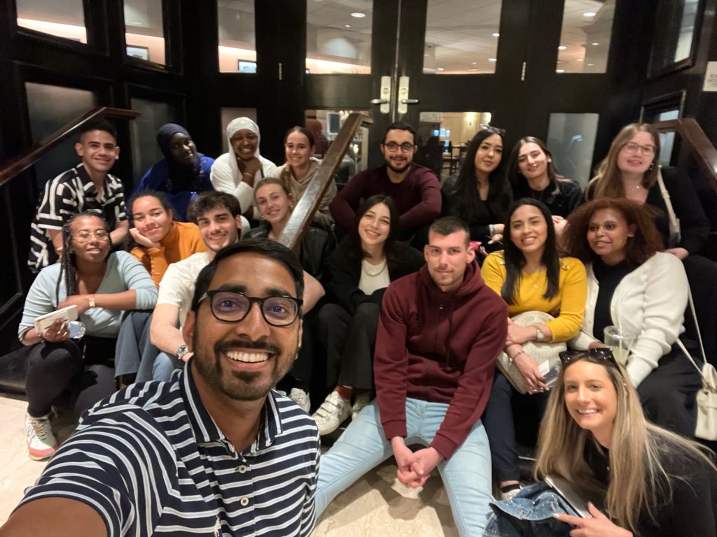A group photo of volunteers posing, smiling and together.