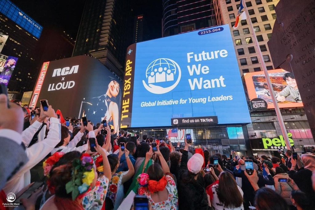 A picture from the New York Time Square featuring FWWMUN on a screen